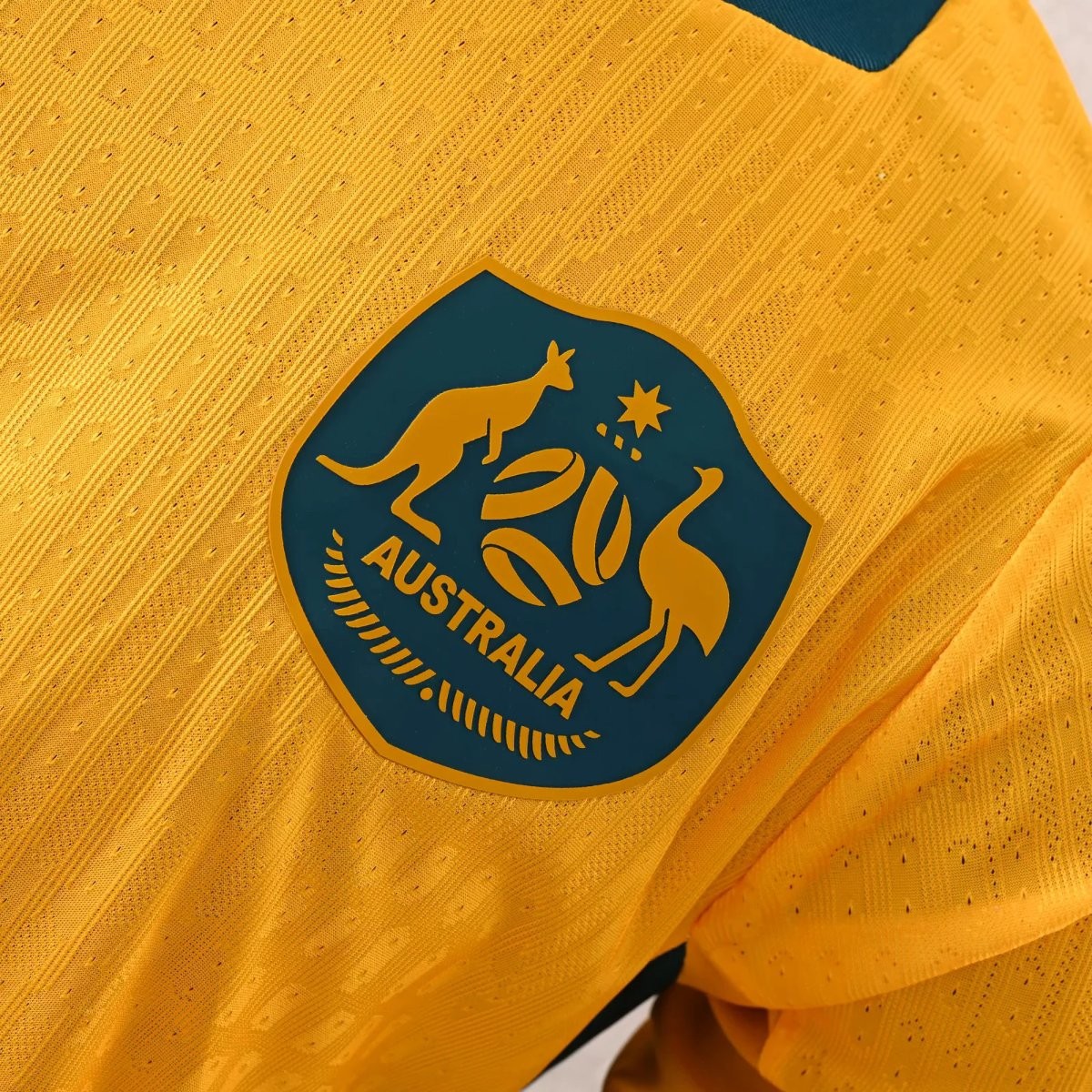 Player Version 2026 Australia Gold with Teal Collar Home Jersey